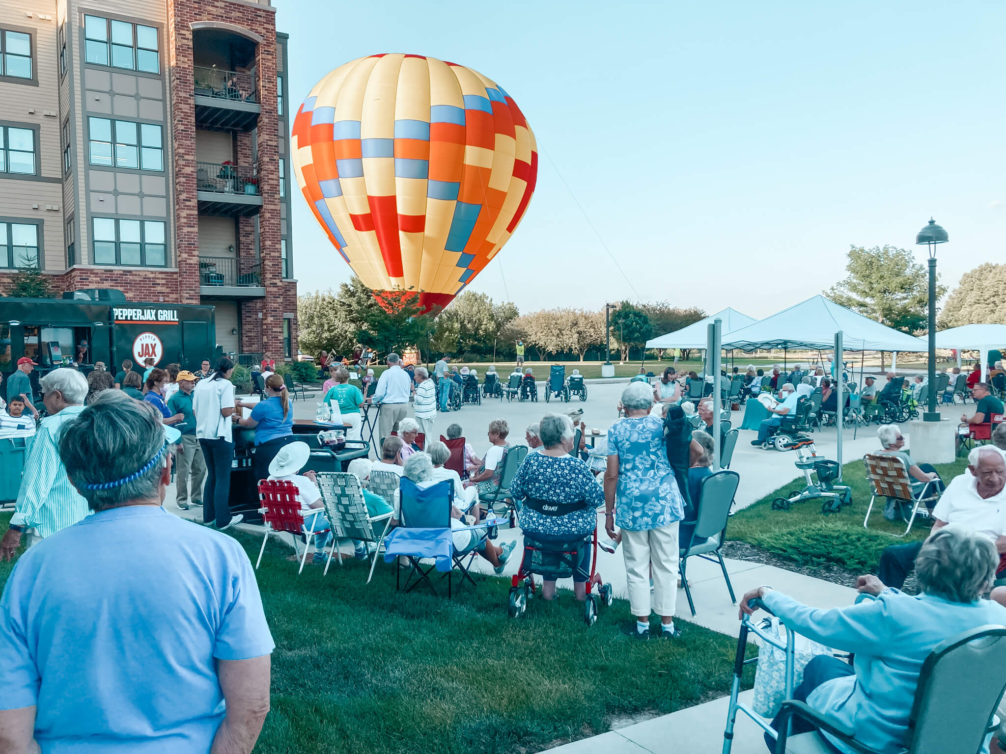 seniors watching a hot air balloon