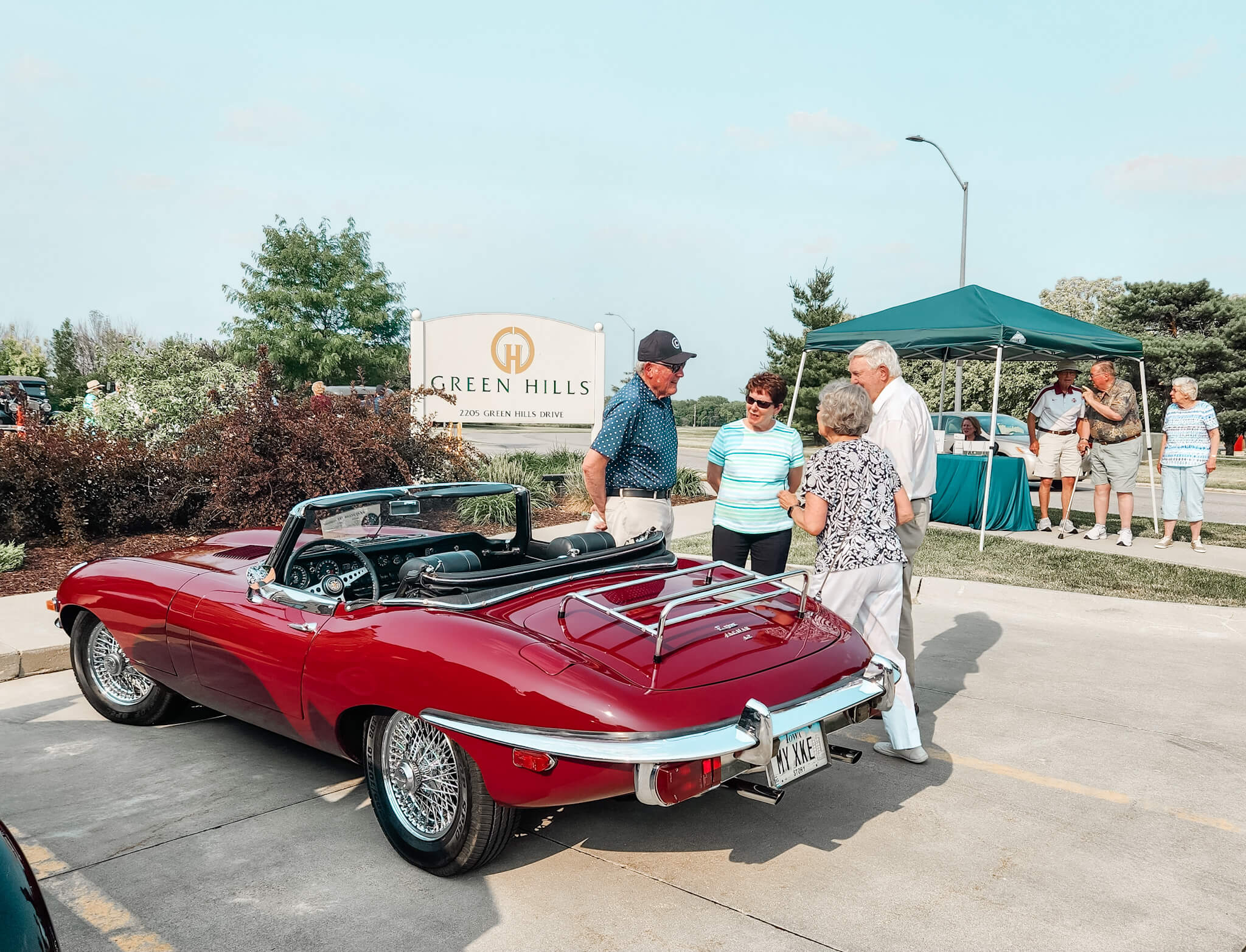 seniors looking at a vintage car