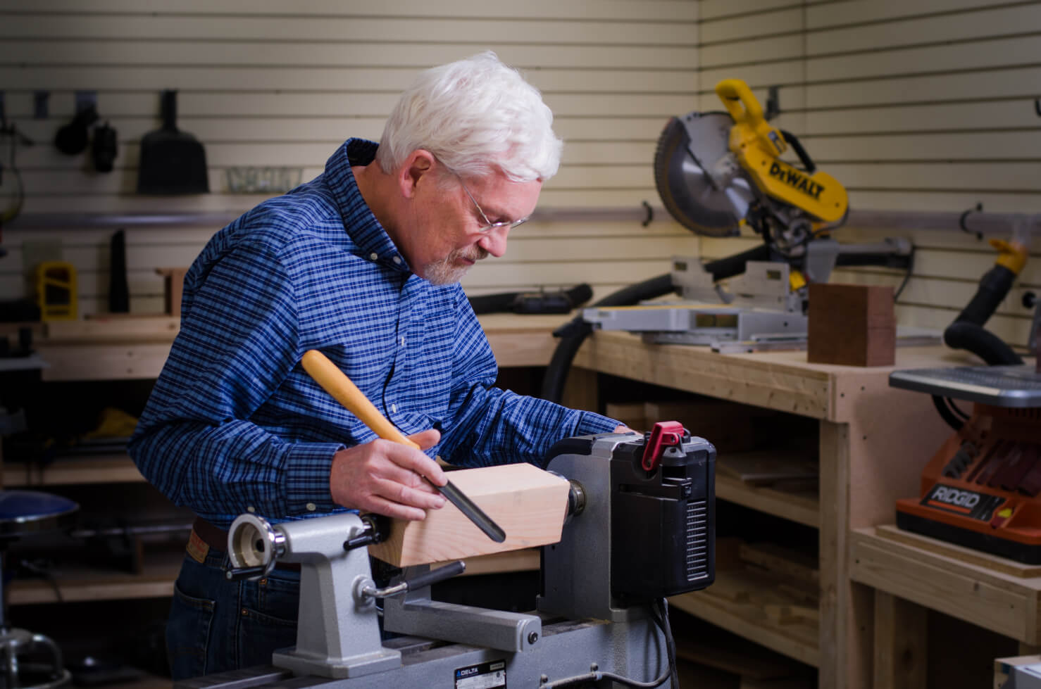 senior man working in the woodshop