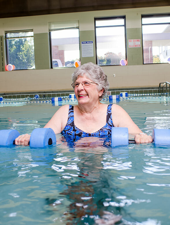 senior woman exercising in the water