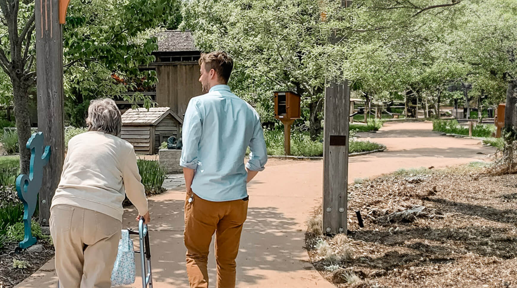 employee walking with a senior woman